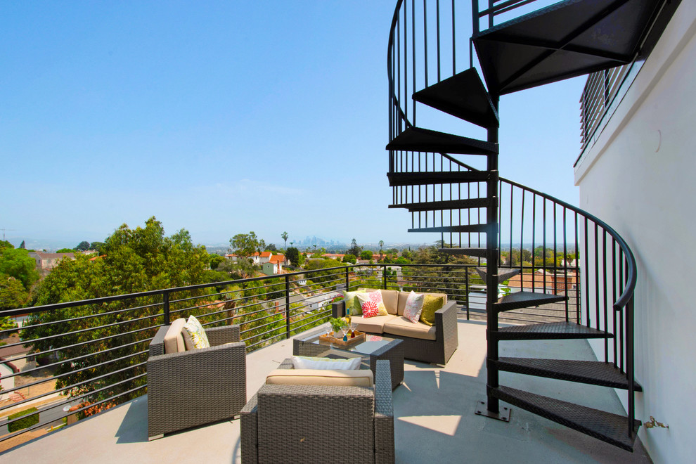 Inspiration for a contemporary balcony in Los Angeles with no cover and metal railing.