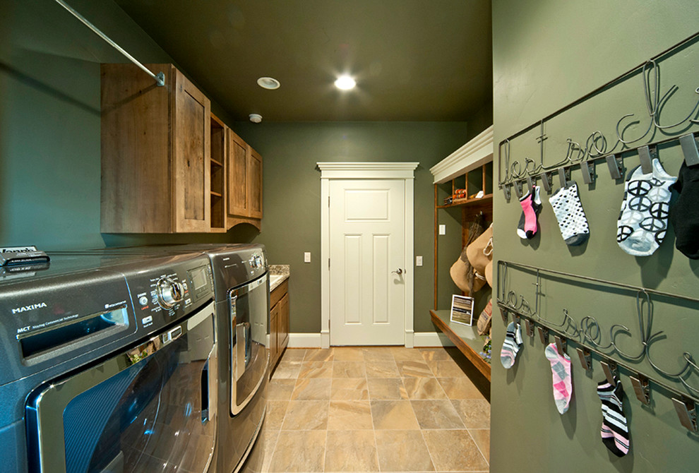 Design ideas for a small country galley utility room in Other with a drop-in sink, shaker cabinets, medium wood cabinets, laminate benchtops, green walls, ceramic floors and a side-by-side washer and dryer.