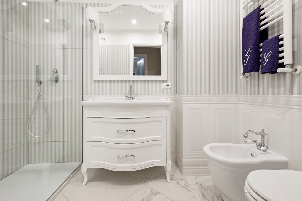 Inspiration for a mid-sized traditional 3/4 bathroom in Rome with furniture-like cabinets, white cabinets, a curbless shower, a bidet, gray tile, matchstick tile, white walls, porcelain floors, a console sink, multi-coloured floor, a hinged shower door, a single vanity, a freestanding vanity and decorative wall panelling.