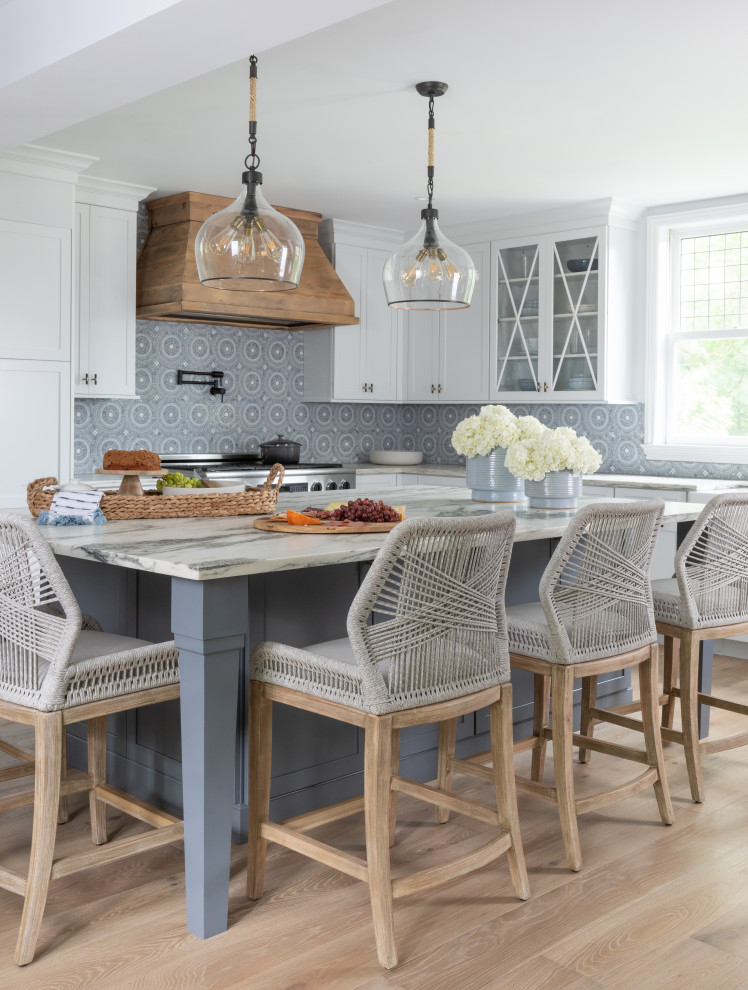 Inspiration for a country eat-in kitchen in New York with blue splashback, stainless steel appliances and with island.