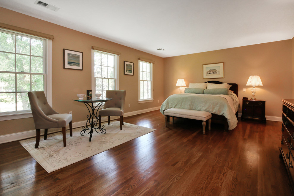 Design ideas for a large eclectic master bedroom in New York with beige walls, medium hardwood floors and no fireplace.