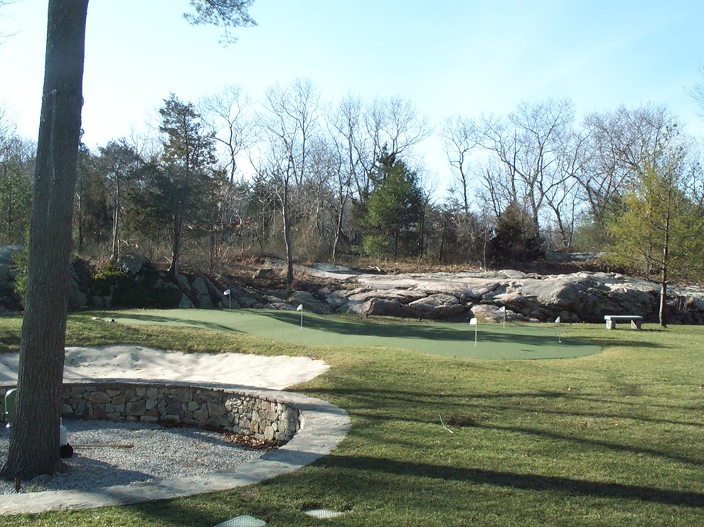 Photo of a mid-sized traditional full sun backyard outdoor basketball/tennis/multi-game court in Boston.