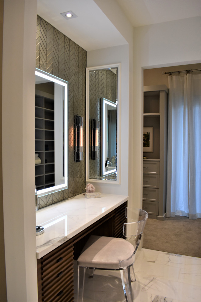 Example of a mid-sized trendy master gray tile and marble tile marble floor, white floor and tray ceiling bathroom design in Miami with raised-panel cabinets, medium tone wood cabinets, a two-piece toilet, gray walls, an undermount sink, marble countertops, a hinged shower door, white countertops, a niche and a built-in vanity
