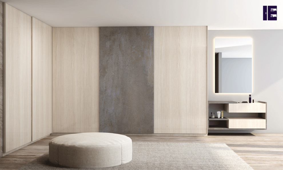 Large contemporary wardrobe in London with flat-panel cabinets and light wood cabinets.