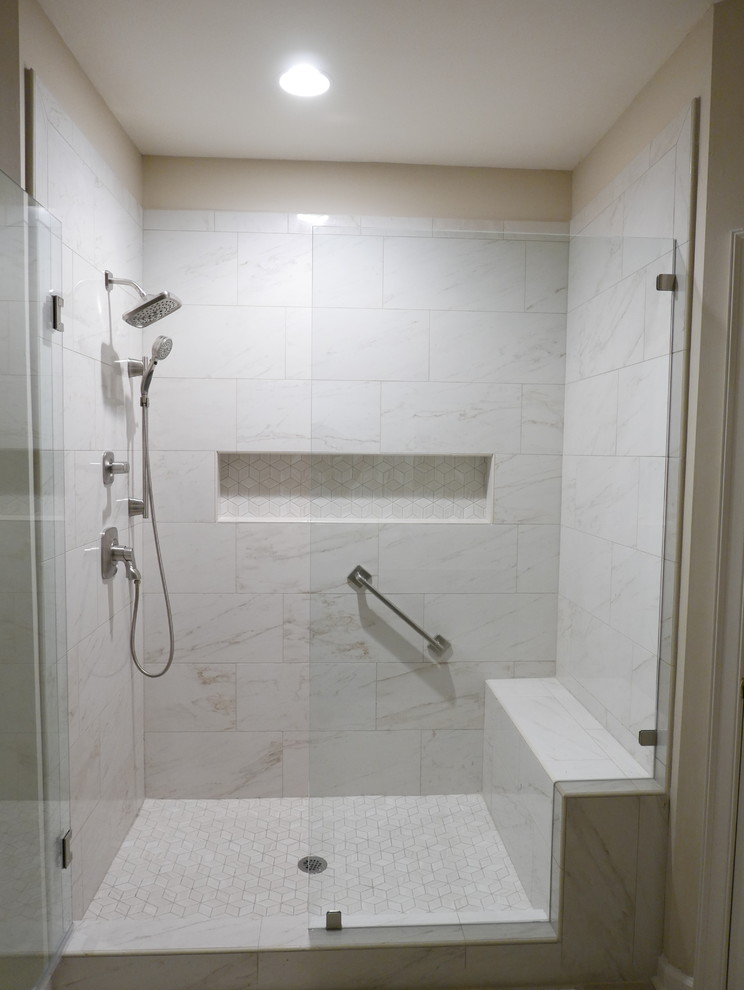 This is an example of a large transitional master bathroom in Other with shaker cabinets, brown cabinets, an alcove shower, a two-piece toilet, beige tile, porcelain tile, beige walls, porcelain floors, an integrated sink, solid surface benchtops, beige floor, a hinged shower door and beige benchtops.