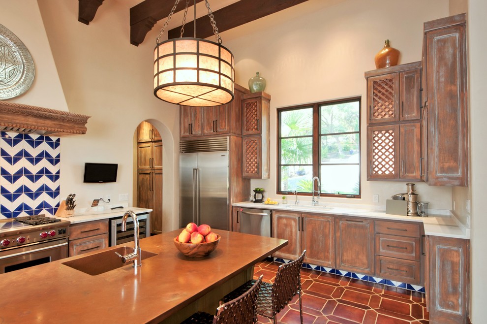 Design ideas for a mediterranean kitchen in Austin with distressed cabinets and copper benchtops.