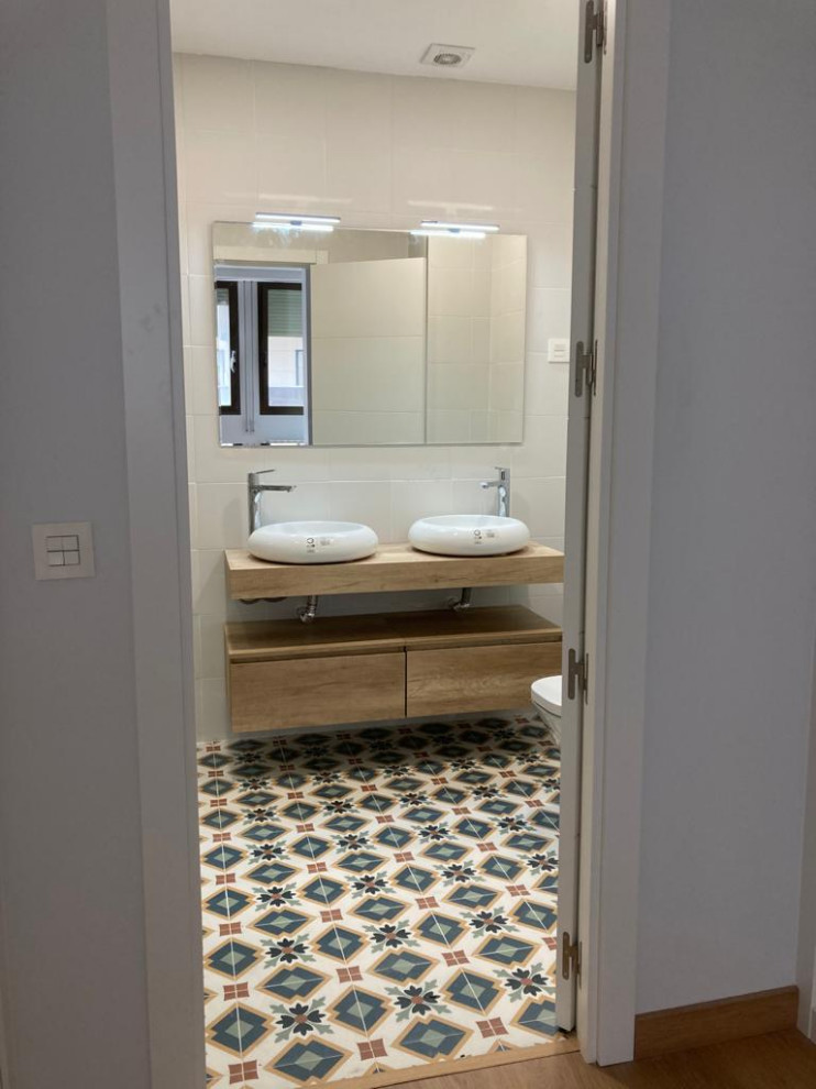 Inspiration for a mid-sized scandinavian master white tile and ceramic tile porcelain tile, multicolored floor and double-sink bathroom remodel in Other with open cabinets, light wood cabinets, a one-piece toilet, white walls, a vessel sink, wood countertops and a floating vanity