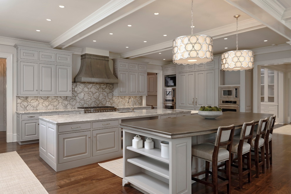 Design ideas for a traditional kitchen in DC Metro with an undermount sink, raised-panel cabinets, grey cabinets, multi-coloured splashback, stainless steel appliances, dark hardwood floors and multiple islands.