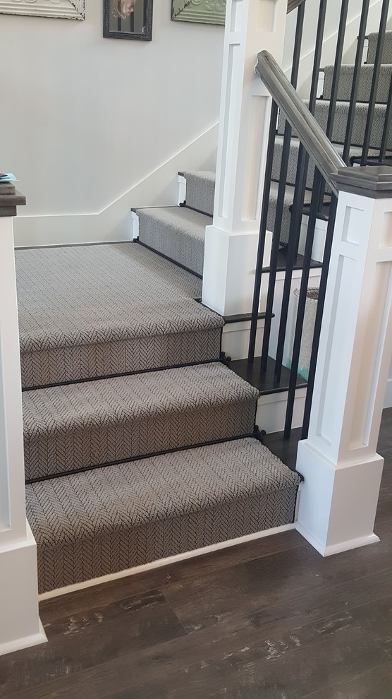 Inspiration for a small traditional carpeted u-shaped staircase in Other with carpet risers and mixed railing.