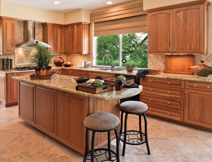 Inspiration for a mid-sized transitional l-shaped eat-in kitchen remodel in Seattle with medium tone wood cabinets and an island