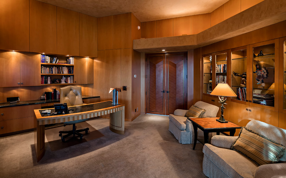 Inspiration for a study room in Phoenix with beige walls, carpet, a freestanding desk and brown floor.