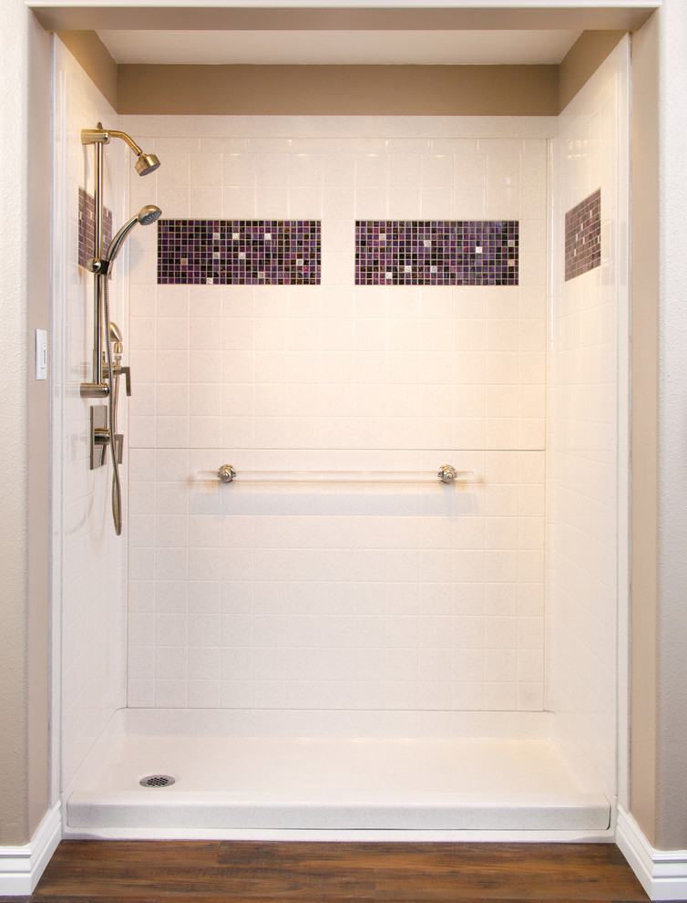 Photo of a bathroom with a curbless shower and an open shower.