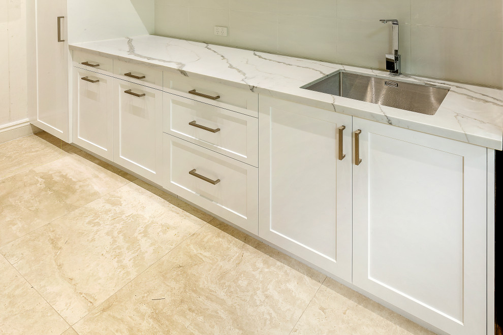 This is an example of a contemporary laundry room in Brisbane.