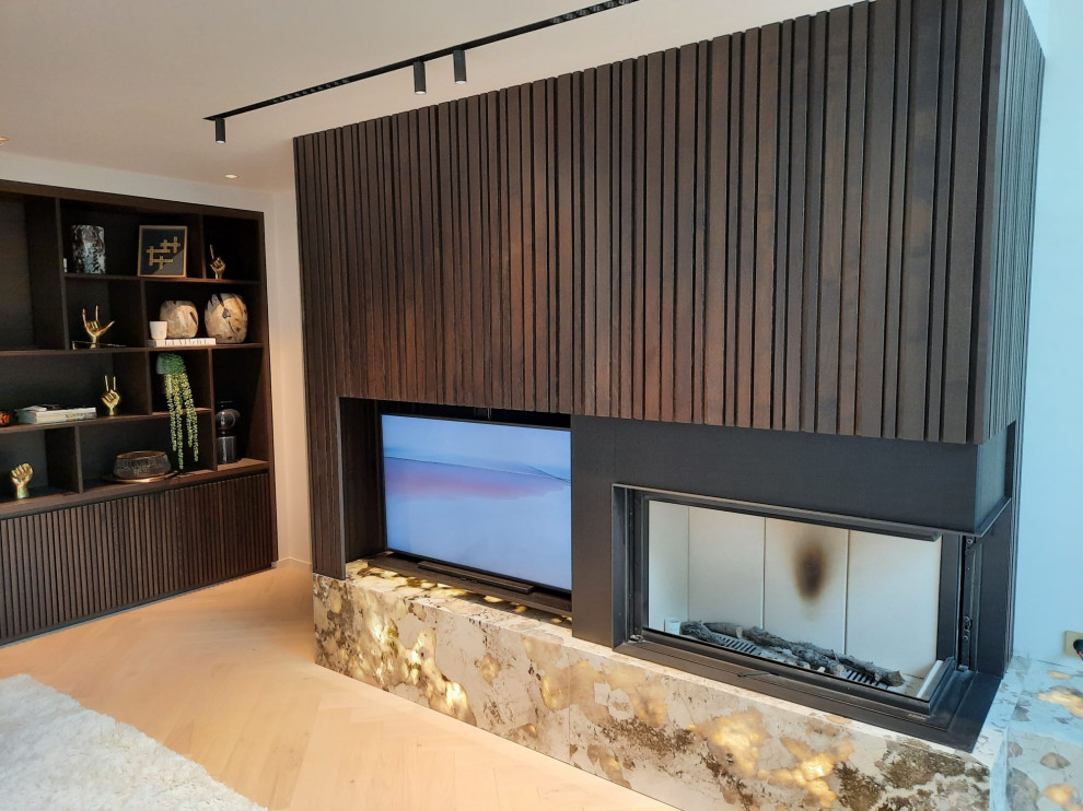 Contemporary living room in Strasbourg with a corner fireplace.