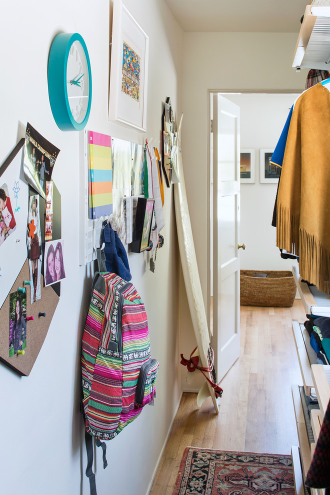 Hallway - transitional light wood floor hallway idea with white walls