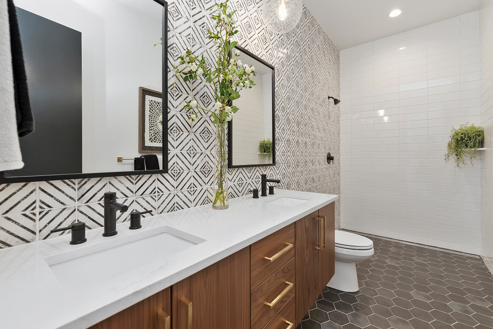Contemporary bathroom in Boise with flat-panel cabinets, medium wood cabinets, a curbless shower, black and white tile, an undermount sink, grey floor, an open shower, white benchtops, a double vanity and a floating vanity.