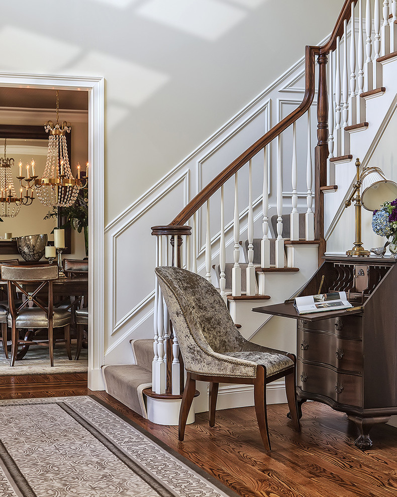 Inspiration for a small transitional medium tone wood floor and brown floor foyer remodel with beige walls