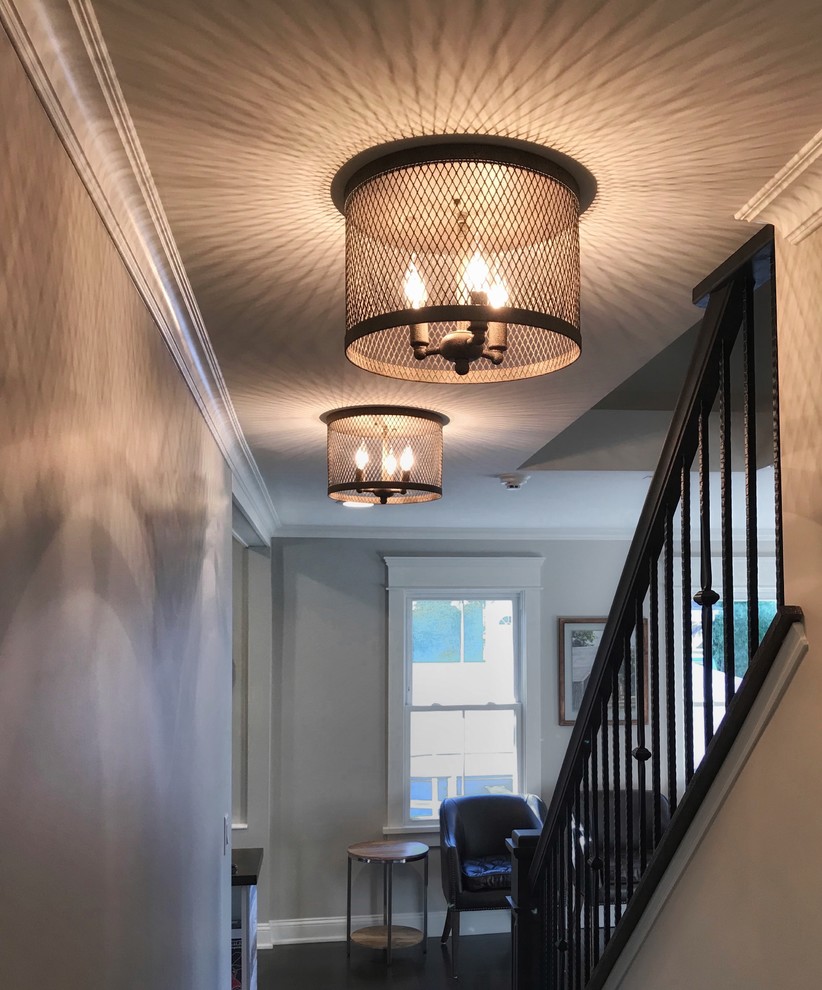 Mid-sized transitional dark wood floor and brown floor hallway photo with gray walls