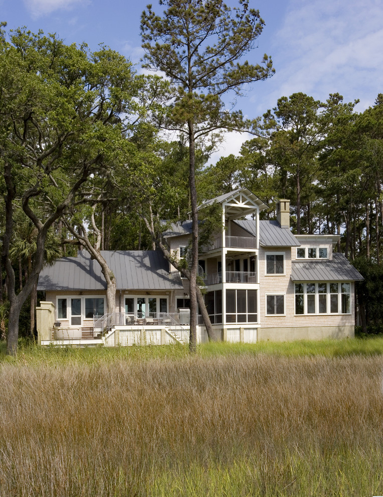 Beach style exterior in Atlanta with wood siding.