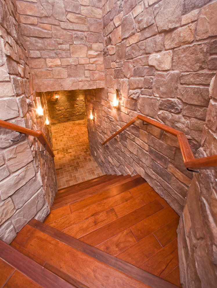 Photo of a mid-sized mediterranean wood curved staircase in Phoenix with wood risers.