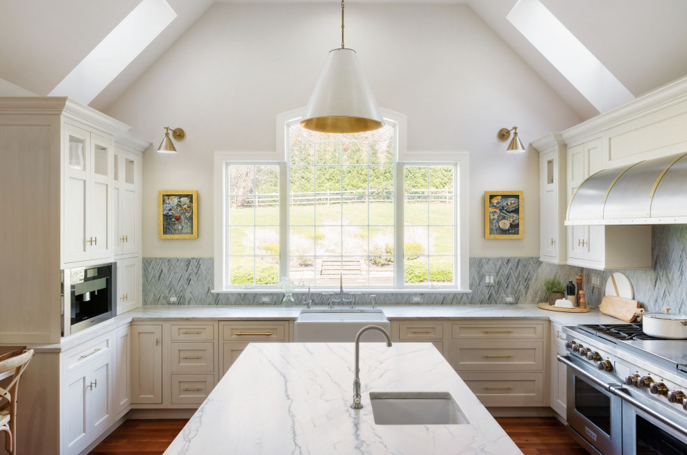 Kitchen - transitional kitchen idea in Philadelphia with white cabinets and quartzite countertops
