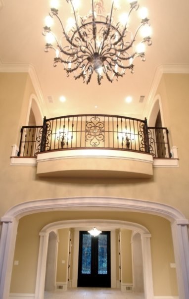 Photo of a large traditional foyer in Atlanta with yellow walls, marble floors, a double front door, a glass front door and grey floor.