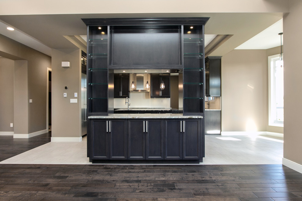 Example of a transitional home design design in Edmonton