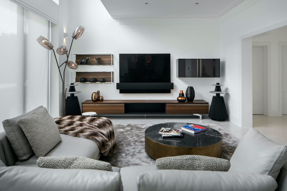 Inspiration for a large contemporary open concept living room in Essex with marble floors, a wall-mounted tv, white walls and beige floor.