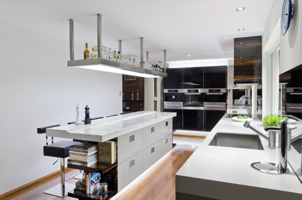 This is an example of a contemporary kitchen in Brisbane with stainless steel appliances.