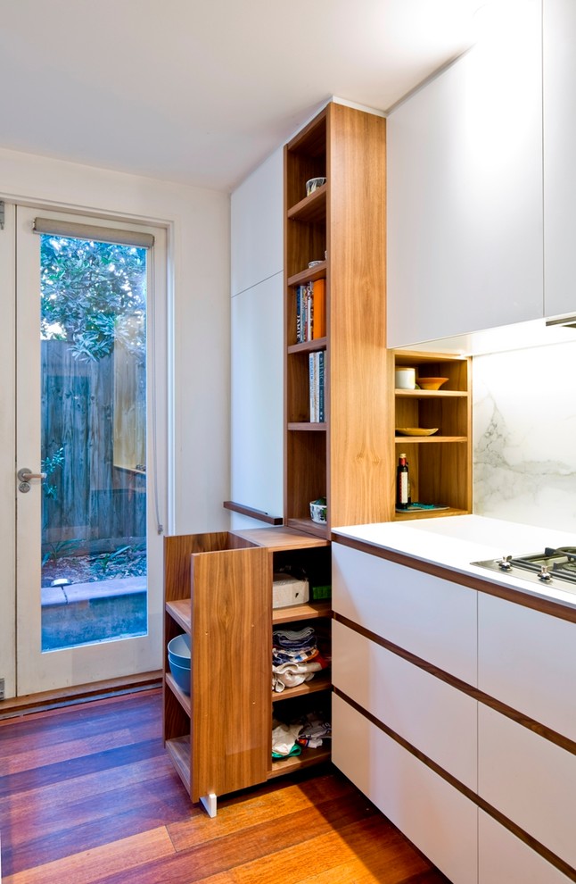 Inspiration for a mid-sized contemporary u-shaped eat-in kitchen in Melbourne with a double-bowl sink, dark wood cabinets, white splashback, stone slab splashback, stainless steel appliances, dark hardwood floors and with island.