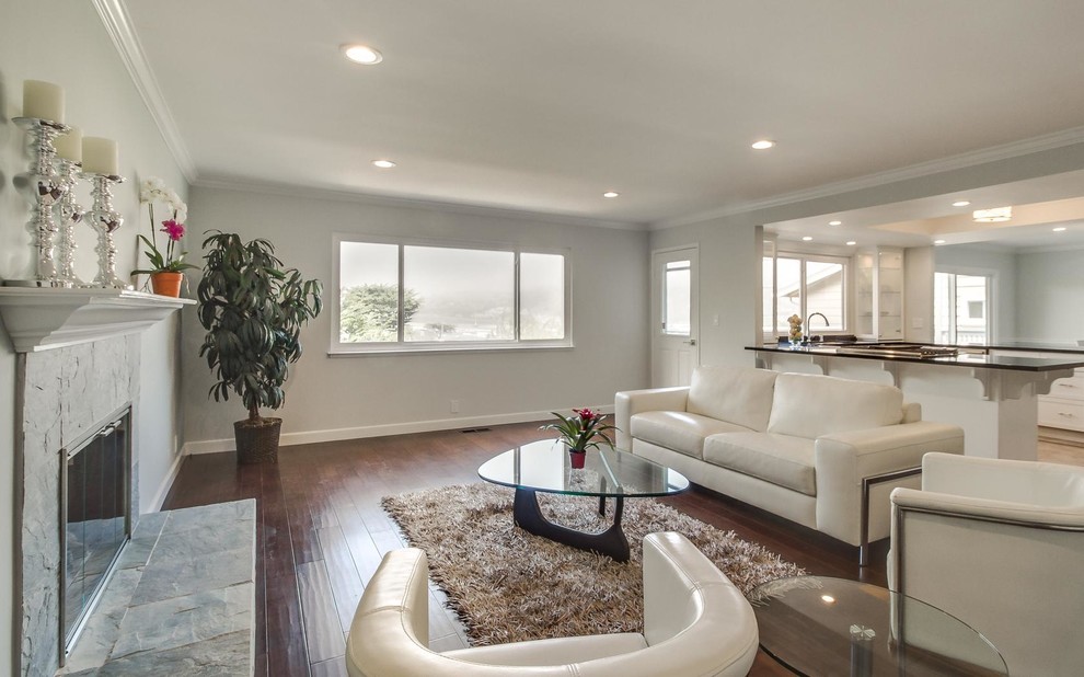 This is an example of a mid-sized contemporary formal open concept living room in San Francisco with grey walls, dark hardwood floors, a standard fireplace, a tile fireplace surround and no tv.