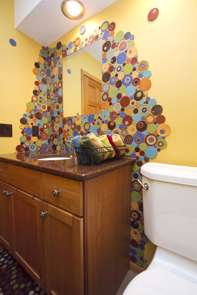 Small eclectic 3/4 bathroom in Other with an undermount sink, recessed-panel cabinets, medium wood cabinets, a one-piece toilet, multi-coloured tile, ceramic tile and yellow walls.