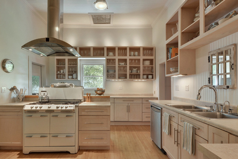 Traditional separate kitchen in Austin with a triple-bowl sink, open cabinets, white cabinets, white splashback, light hardwood floors and with island.