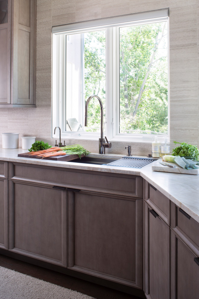Example of a transitional kitchen design in Denver