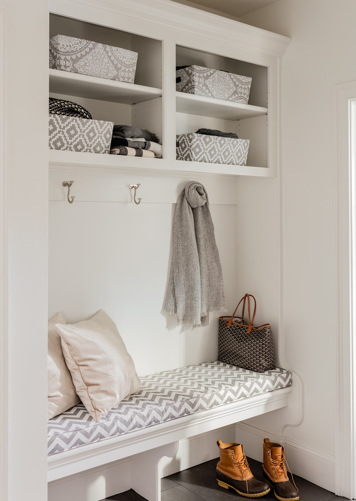 Small traditional mudroom in Boston with white walls.