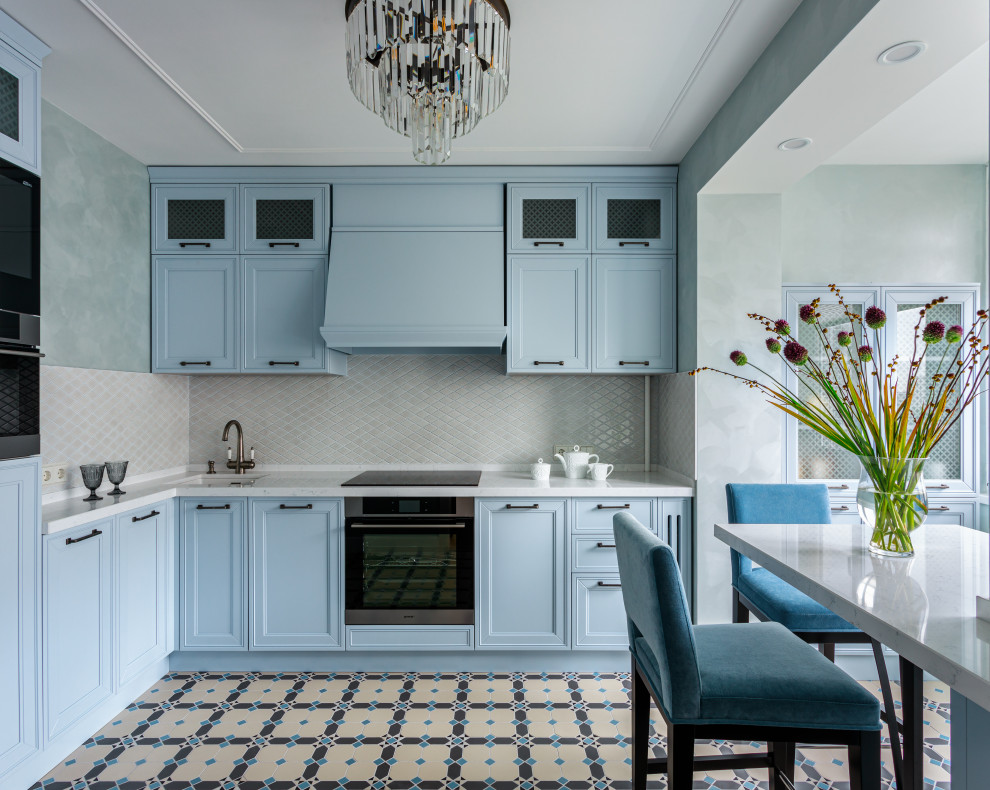 Inspiration for a small transitional l-shaped separate kitchen in Moscow with an undermount sink, raised-panel cabinets, turquoise cabinets, quartz benchtops, white splashback, ceramic splashback, stainless steel appliances, porcelain floors, no island, multi-coloured floor and white benchtop.