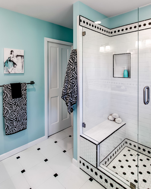 black and white bathroom with zebra towels and black spot tiles
