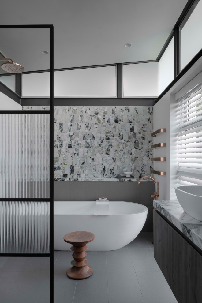 Inspiration for an expansive contemporary master bathroom in Sydney with flat-panel cabinets, medium wood cabinets, a freestanding tub, an open shower, green tile, marble, ceramic floors, a vessel sink, marble benchtops, grey floor, an open shower, green benchtops, a double vanity, a floating vanity and exposed beam.