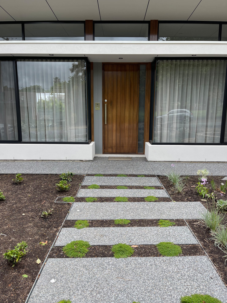 Idee per un giardino contemporaneo esposto in pieno sole di medie dimensioni e davanti casa con pavimentazioni in pietra naturale