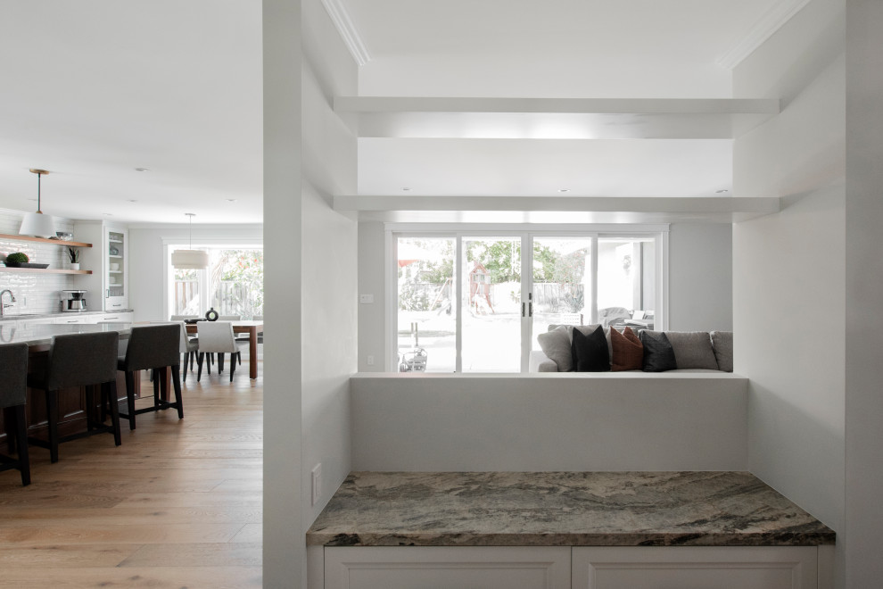 Example of a small arts and crafts light wood floor foyer design in San Francisco with beige walls