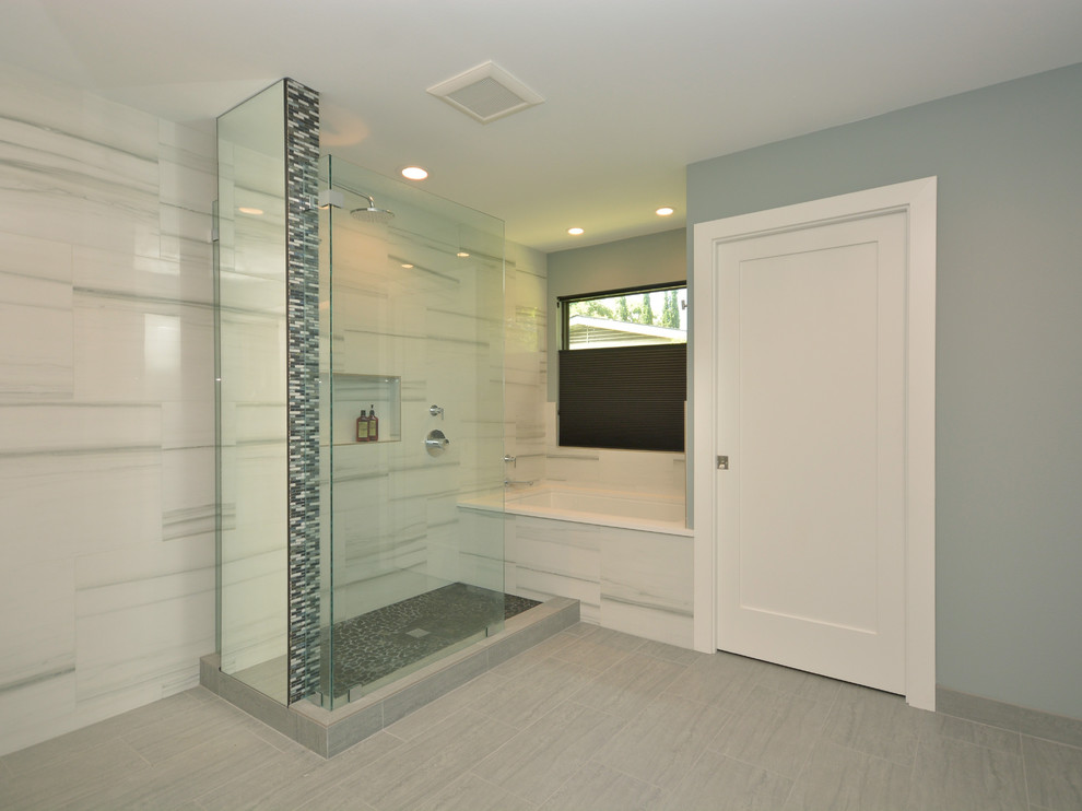 Inspiration for a mid-sized contemporary master bathroom in Austin with flat-panel cabinets, dark wood cabinets, an alcove tub, an open shower, black tile, black and white tile, gray tile, matchstick tile, white walls, ceramic floors, an undermount sink and solid surface benchtops.