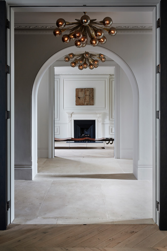 This is an example of a mid-sized contemporary hallway in London with white walls.