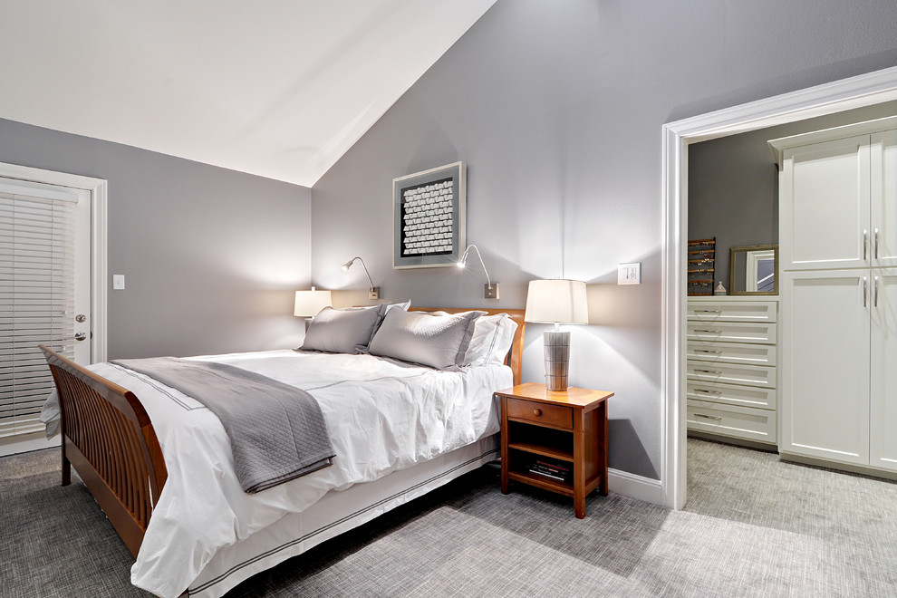 Inspiration for a mid-sized transitional master bedroom in Austin with grey walls.