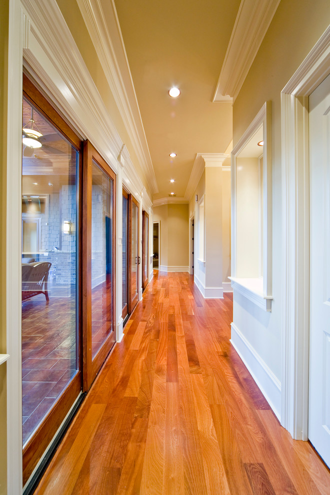 Inspiration for a mid-sized arts and crafts hallway in Atlanta with brown walls, medium hardwood floors and brown floor.
