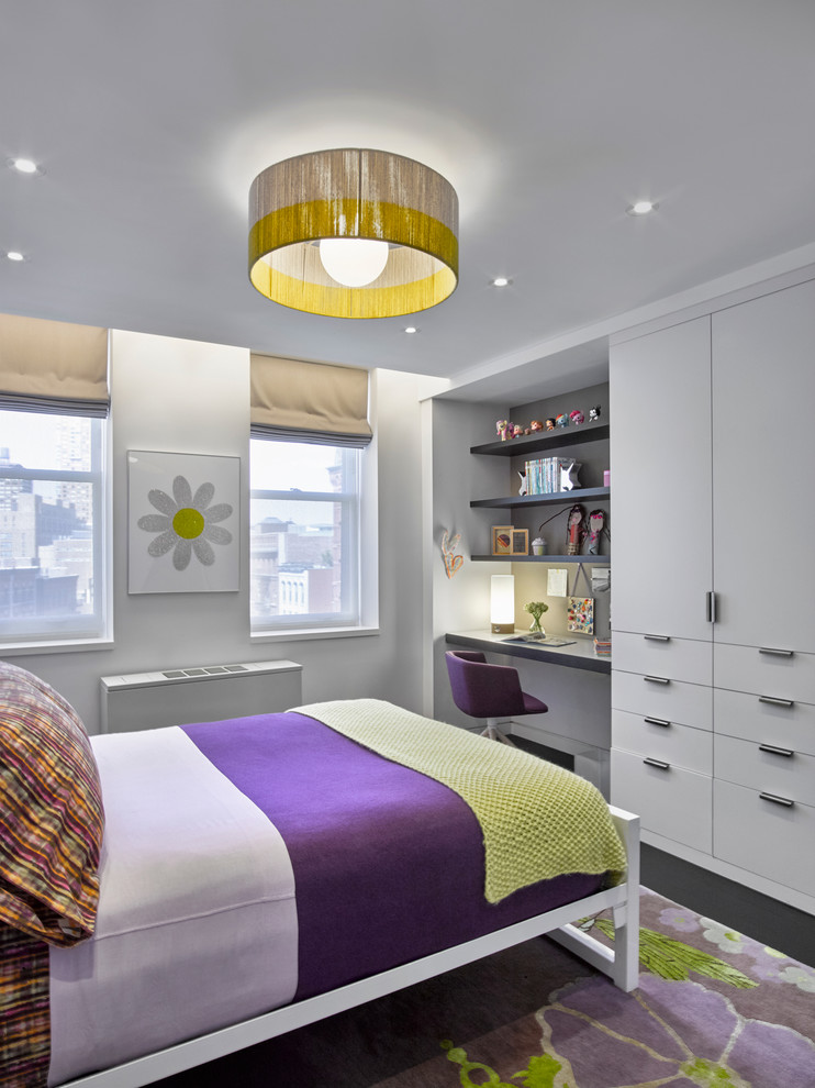 Contemporary kids' bedroom in New York with white walls and dark hardwood floors for kids 4-10 years old and girls.