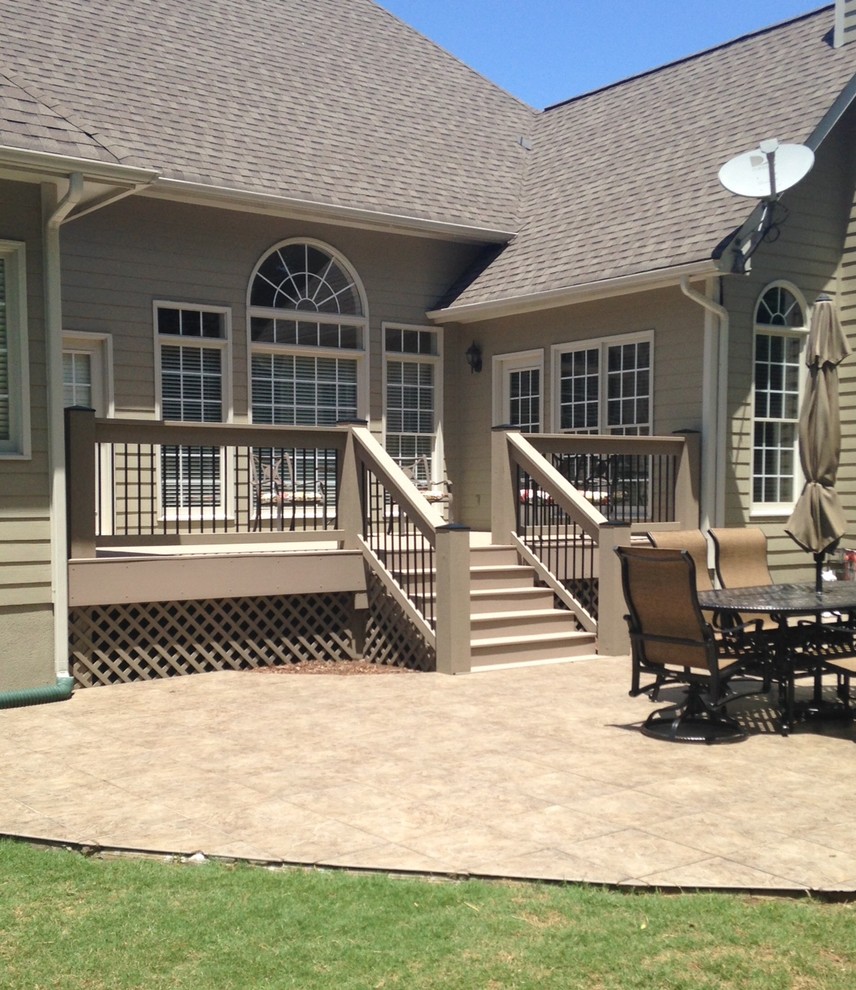Mid-sized elegant backyard deck photo with no cover