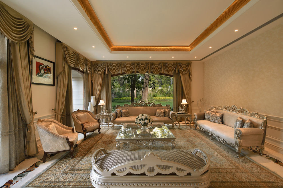 Inspiration for a large traditional living room in Delhi with beige walls.