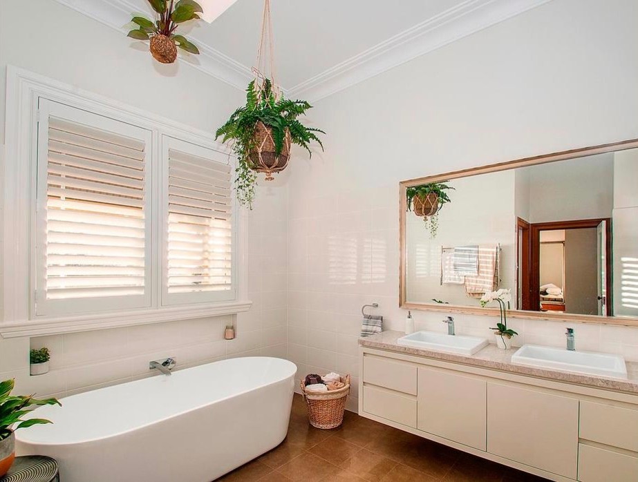 Design ideas for a large contemporary master bathroom in Sydney with flat-panel cabinets, white cabinets, a freestanding tub, an open shower, a one-piece toilet, white tile, ceramic tile, beige walls, ceramic floors, an integrated sink and engineered quartz benchtops.