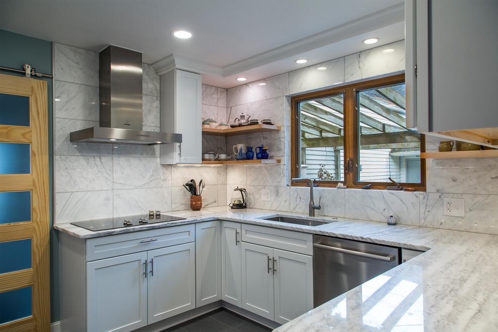 Photo of a small contemporary u-shaped eat-in kitchen in Detroit with an undermount sink, recessed-panel cabinets, white cabinets, marble benchtops, white splashback, marble splashback, stainless steel appliances, porcelain floors, no island and grey floor.