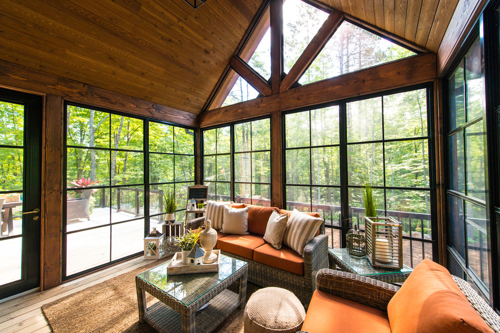 Design ideas for a country sunroom in Toronto with medium hardwood floors and a standard ceiling.